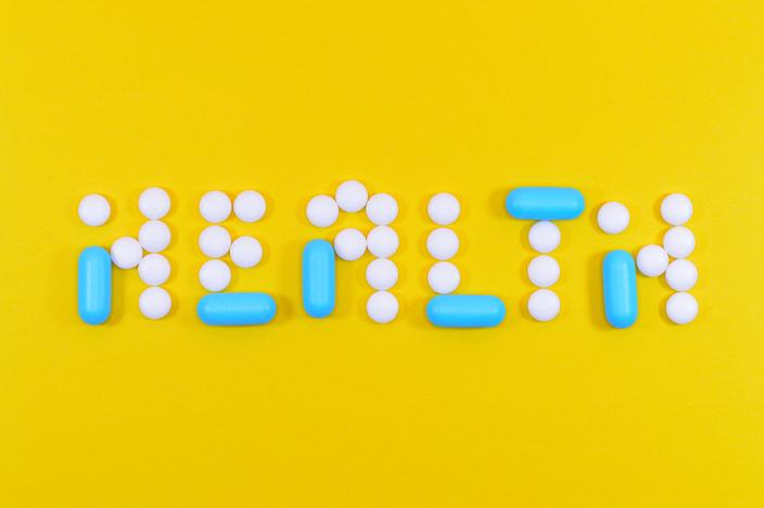white and blue tablets spelling out the word HEALTH